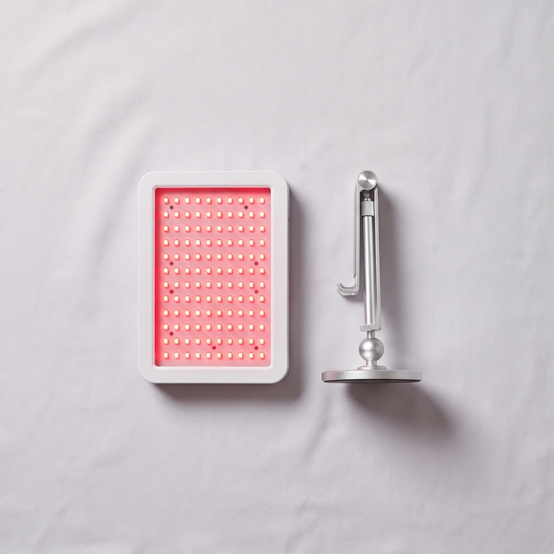 Recovery Stack bundle — red light therapy panel beside the 360 degree panel stand