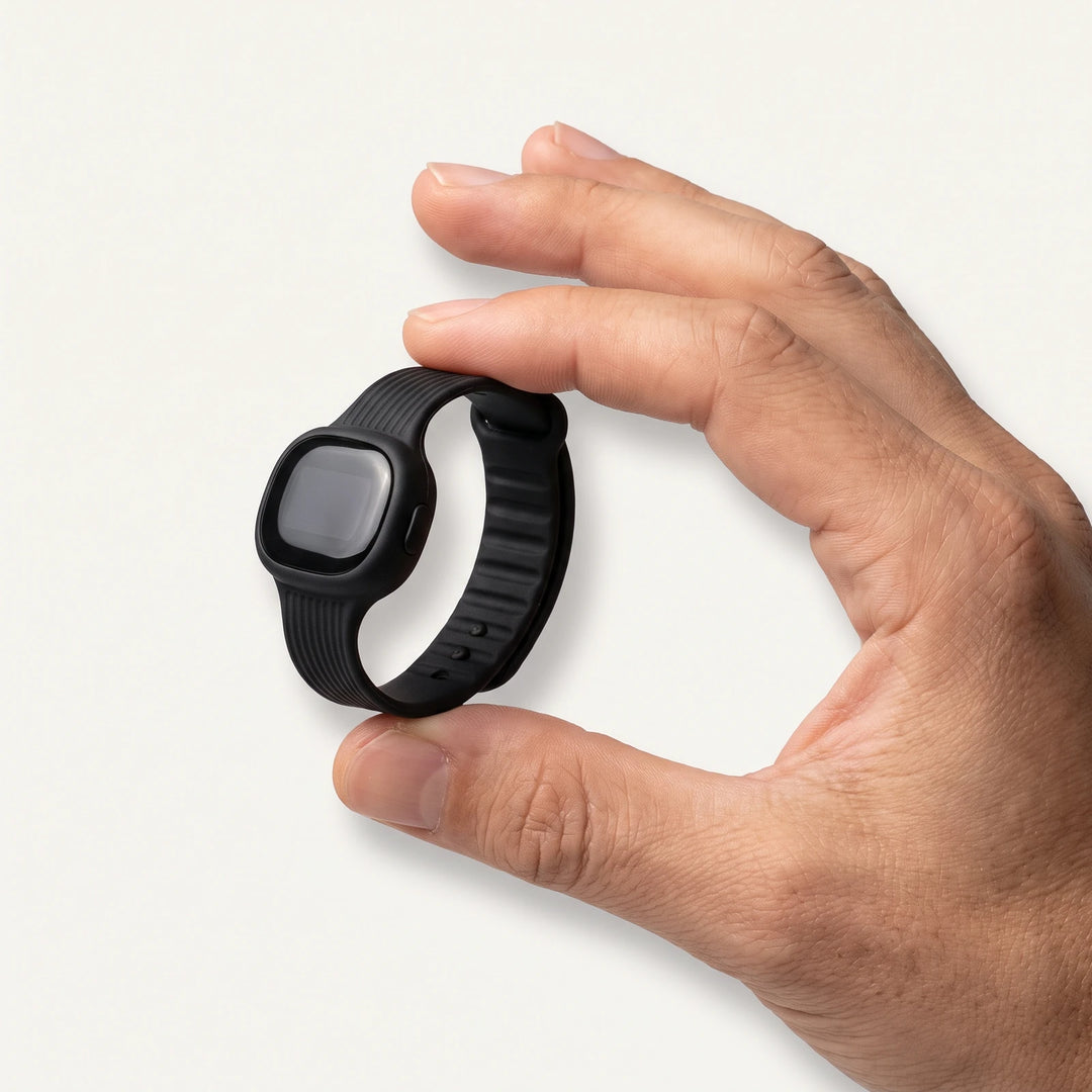 The band held between finger and thumb, showing how small it is