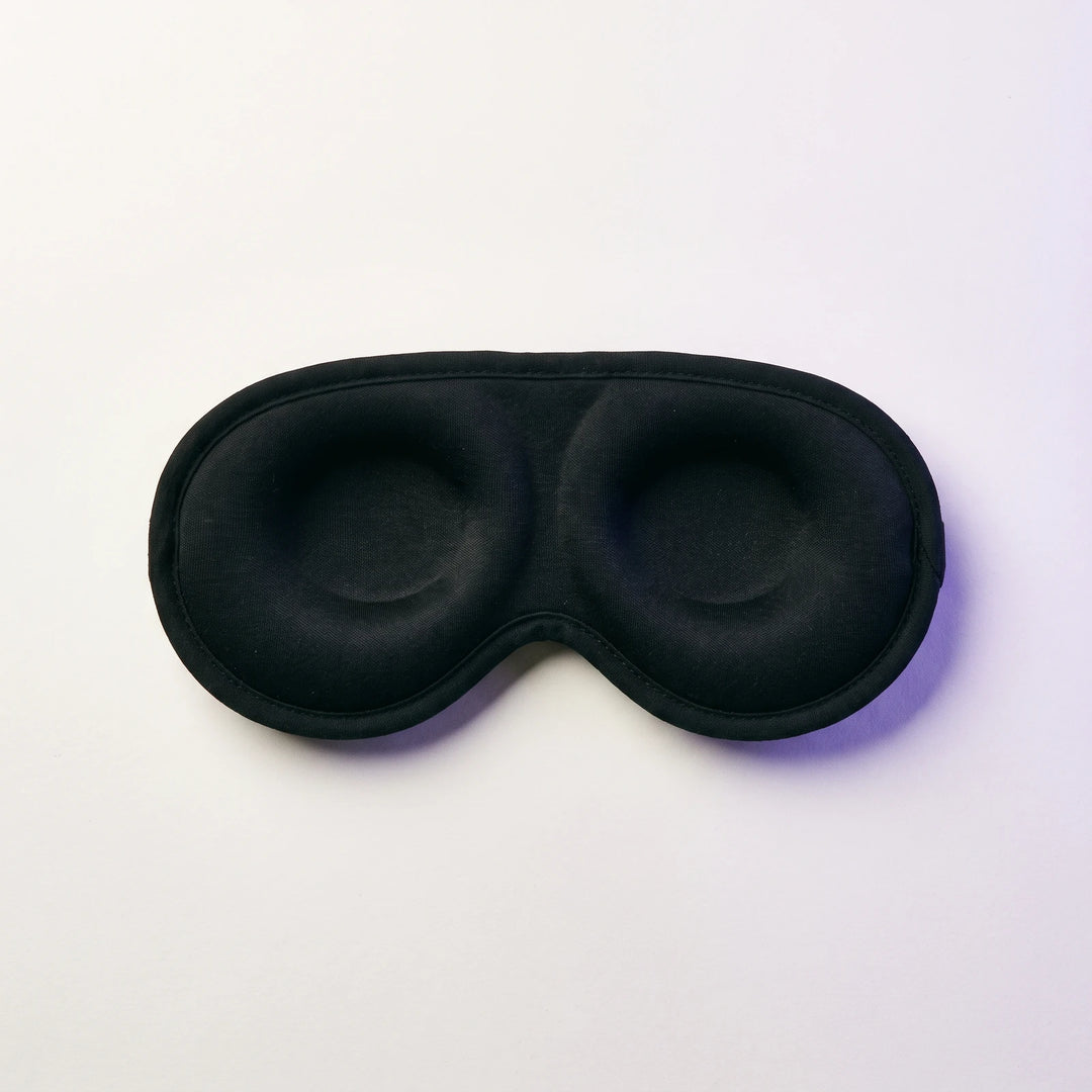 The inside of the mask, showing the two shallow eye cups and the cotton face