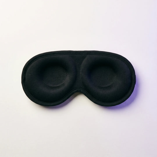 The inside of the mask, showing the two shallow eye cups and the cotton face