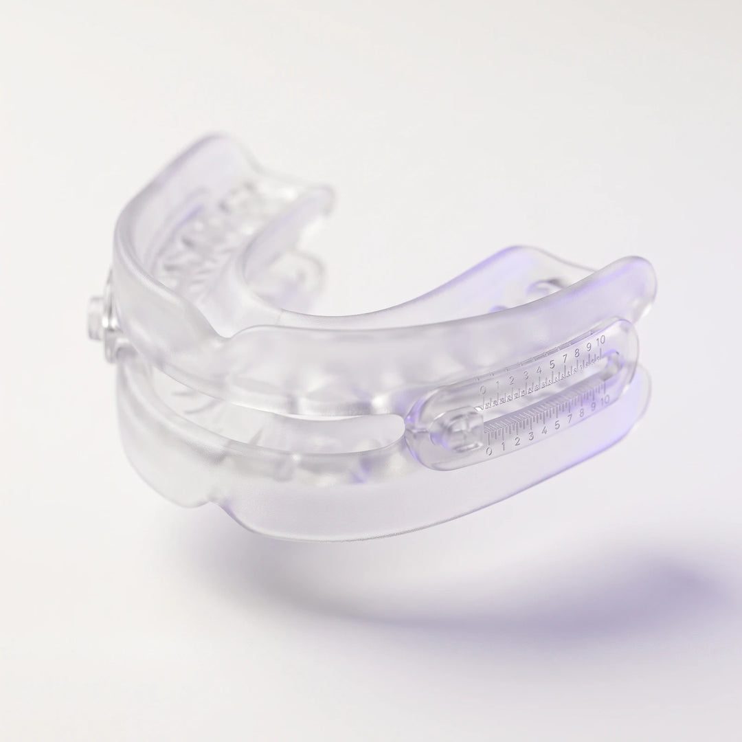The HUSD Nightpiece in clear frosted thermoplastic, three-quarter view above an off-white surface