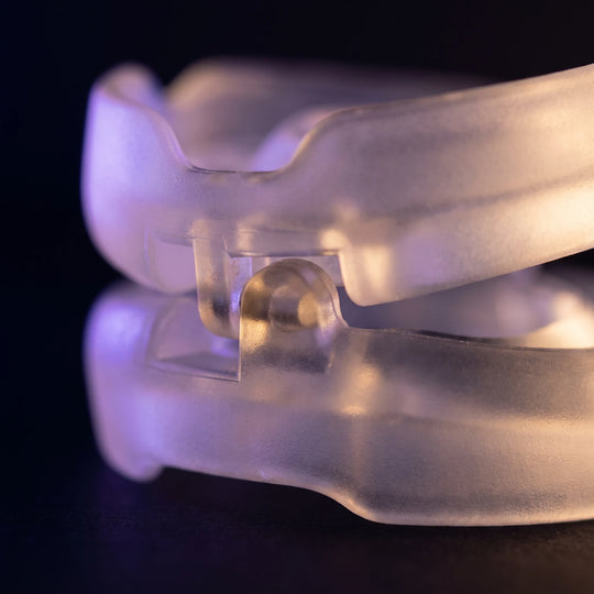 Macro of one side hinge of the Nightpiece Pro, the two arches pivoting around it