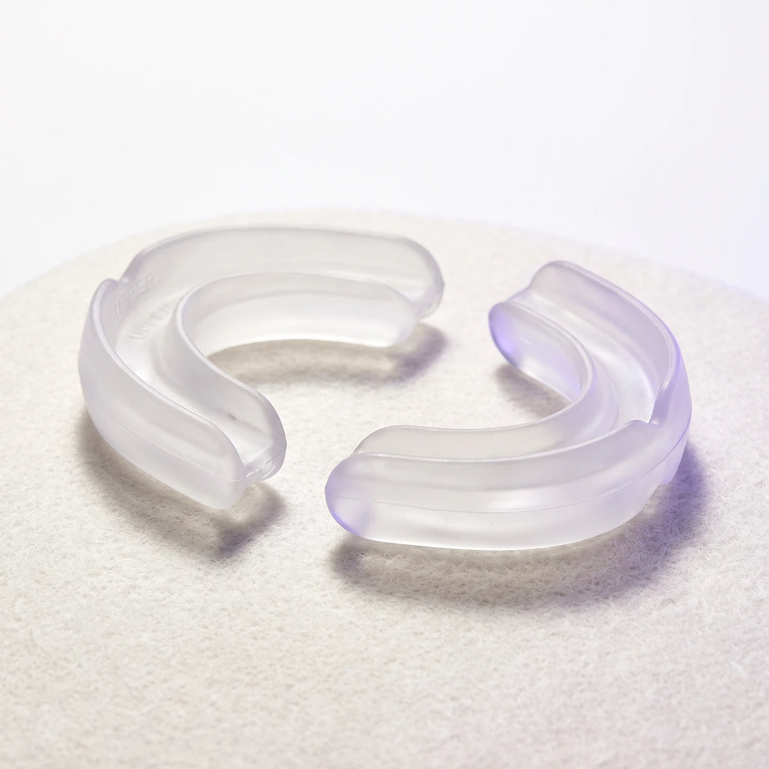 The Nightpiece Pro separated into its upper and lower arches, lying apart