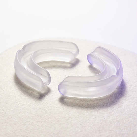 The Nightpiece Pro separated into its upper and lower arches, lying apart