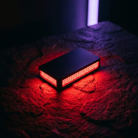 The panel switched on, deep red light pooling across dark stone