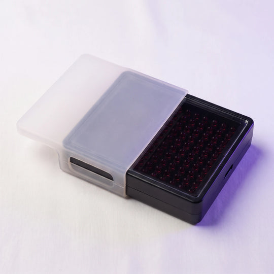 The silicone lens cover half slid onto the unlit panel
