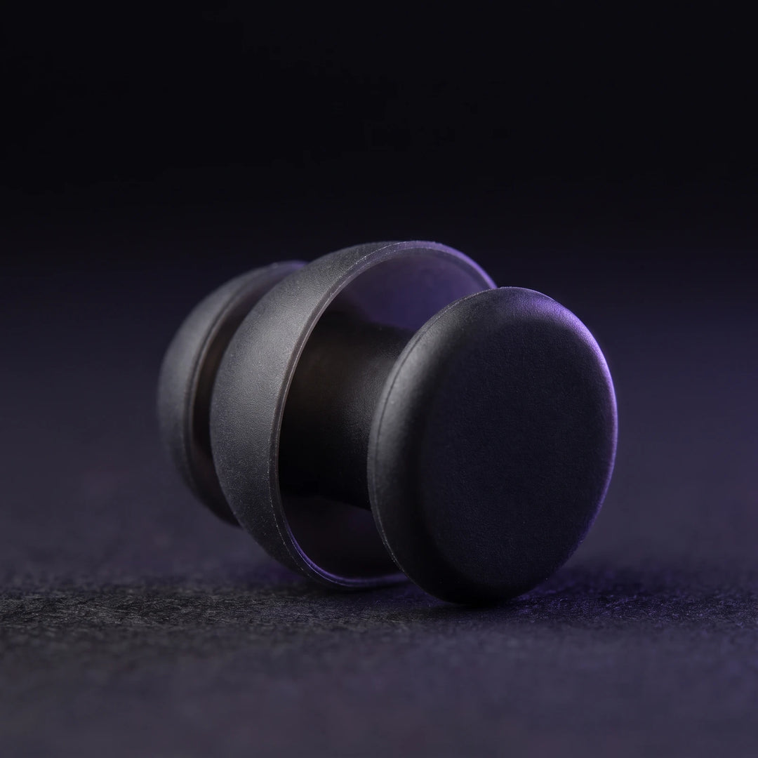 Macro of a single earplug showing the moulded flanges and the flat outer face
