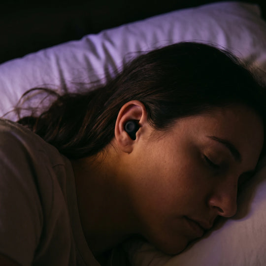 A side sleeper with the pillow pressing against the ear rather than the plug
