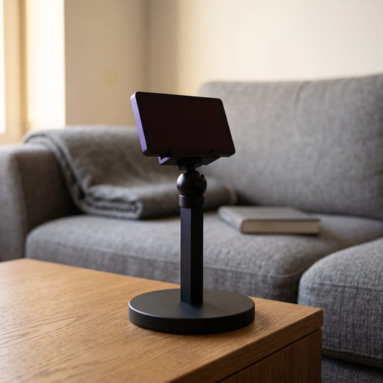 The stand on an oak side table beside a sofa, holding the unlit panel